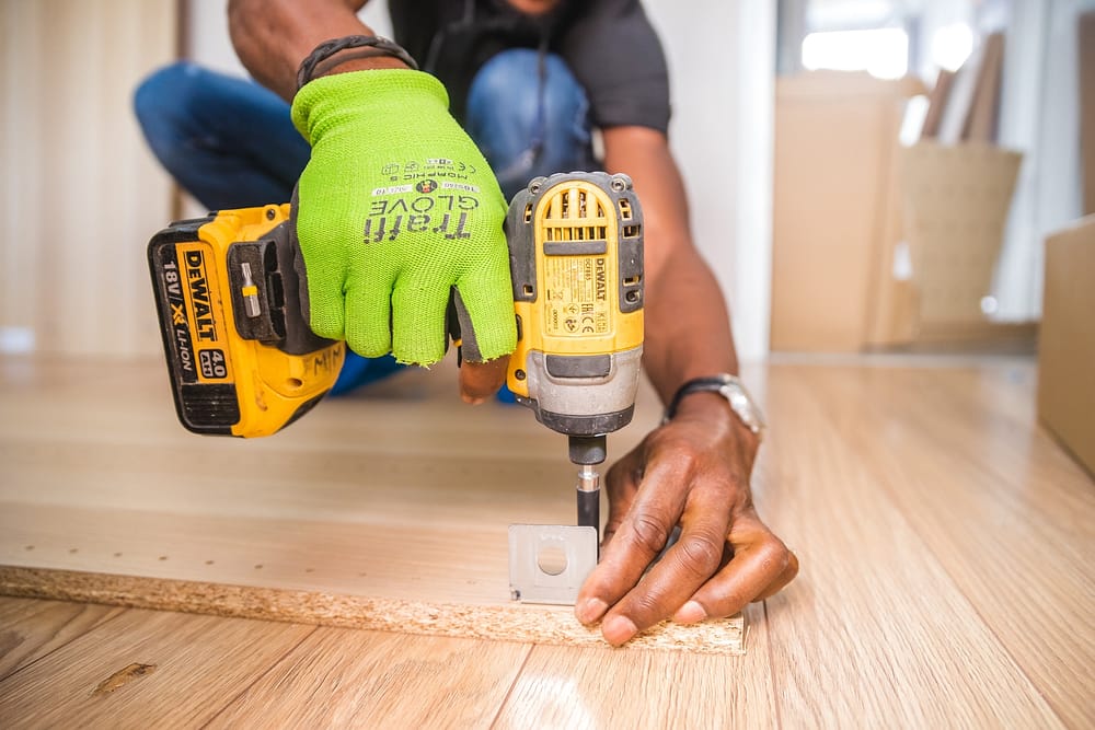 Man using drill on wood 