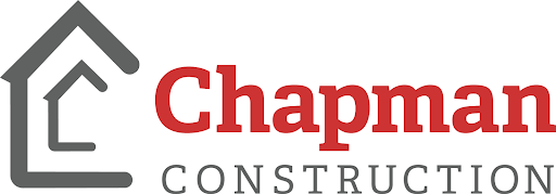 Chapman Construction's logo in red and gray text with the outline of a house to the left.